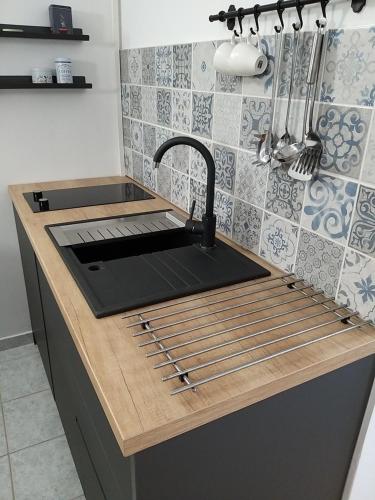 a kitchen with a sink and a counter with a sink at Studio Una, 150m from the sea, parking, Crikvenica, Dramalj in Dramalj