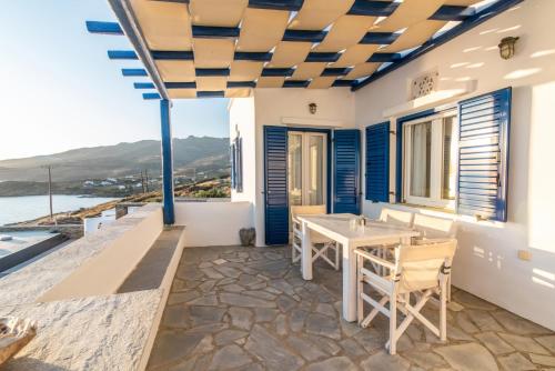a villa with a view of the ocean at Avissalou Apartments in Agios Romanos