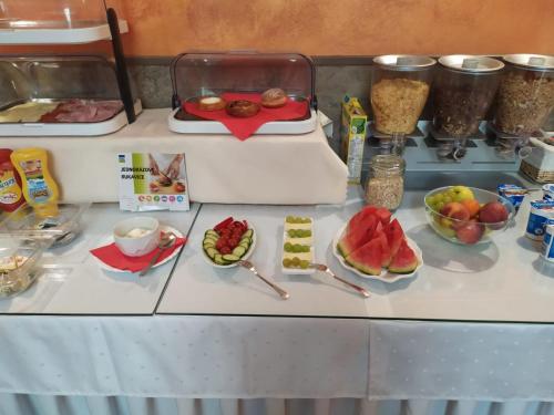 a table with some food on top at Hotel Trumf in Mladá Boleslav