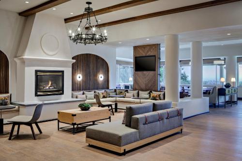 a living room with couches and a fireplace at Chaminade Resort & Spa in Santa Cruz