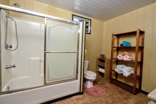 a bathroom with a shower and a toilet at TAHITI - Taharuu Houses Surf & Beach in Papara