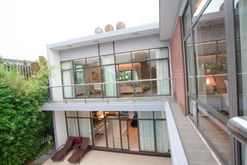 an aerial view of a building with glass windows at Bạch Yến T111-Happy Villa Đại Lải Resort in Vĩnh Phúc