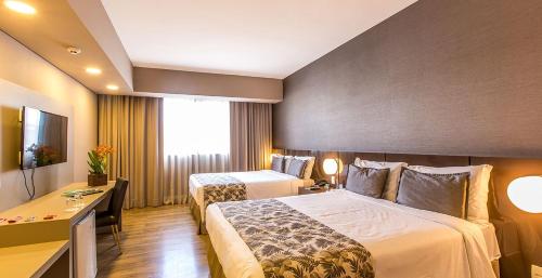 Katil atau katil-katil dalam bilik di Tauá Hotel & Convention Atibaia