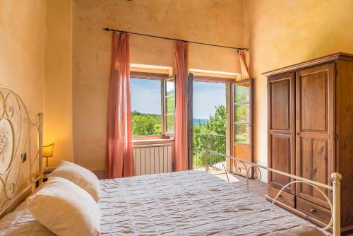 Krevet ili kreveti u jedinici u okviru objekta Borgo Fastelli - House in historical Borgo in Tuscany - Susino