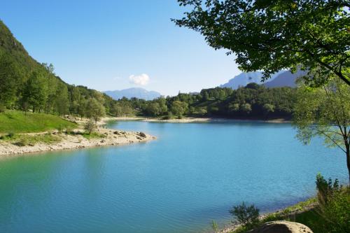 a view of a river with trees and blue water at Club Hotel Tenno in Tenno