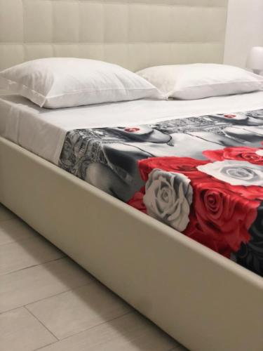 Ein Bett oder Betten in einem Zimmer der Unterkunft Al Porto