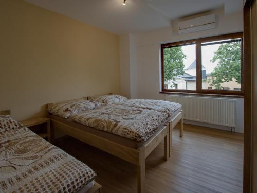 Ένα ή περισσότερα κρεβάτια σε δωμάτιο στο Apartmány Bejby Turnov