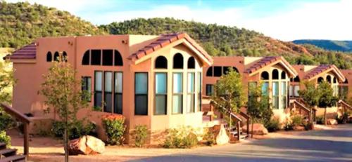 a large building in front of a mountain at Sedona Pines Resort in Sedona