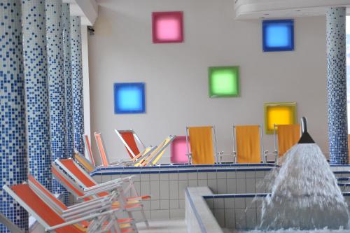 a group of chairs sitting in a waiting room at Panorama Apartman in Velence