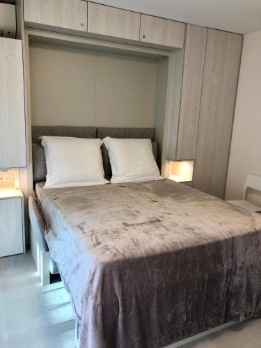 a bedroom with a large bed in a room at Studios Nice Gambetta in Nice