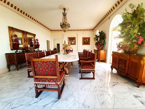 a dining room with a table and chairs at Ocean West Boutique Hotel in Nassau