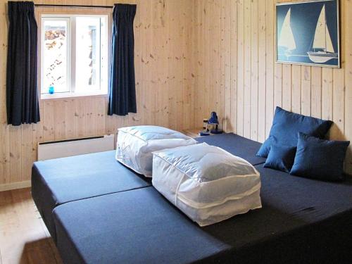 Postel nebo postele na pokoji v ubytování Holiday home Rødby XLII