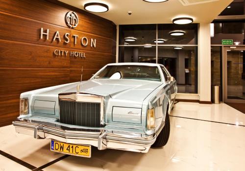 a vintage car is parked in a store at Haston City Hotel in Wrocław