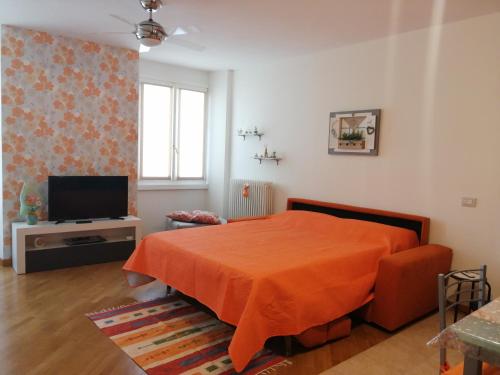 Televízia a/alebo spoločenská miestnosť v ubytovaní Residence Edera