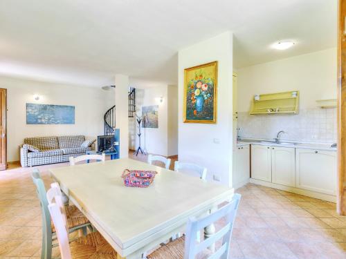 a kitchen and dining room with a table and chairs at Pleasing Holiday Home in Sorano with Swimming Pool in Sorano