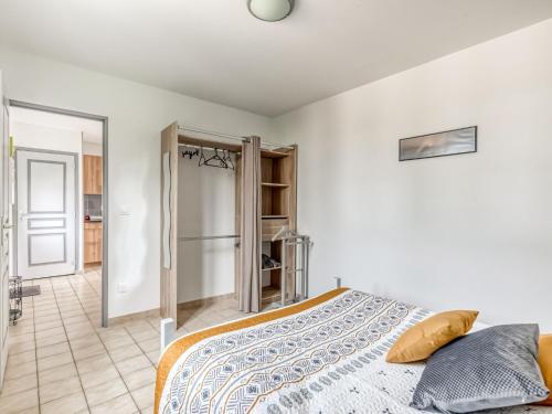 a bedroom with a bed in a room at Bronte s Coastal Retreat in Tracy-sur-Mer