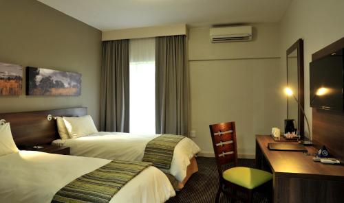Katil atau katil-katil dalam bilik di ANEW Hotel Hluhluwe