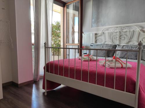 a bedroom with a bed with a red bedspread at Sweet Rome B&B in Rome
