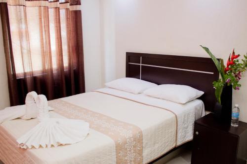 Cama o camas de una habitación en Hotel Humberto
