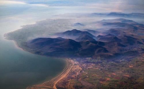 an aerial view of a body of water with mountains at Crotlieve Barn in Rostrevor