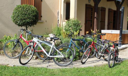 a group of bikes parked next to a house at Maison de Vacances MACOU 2 in Capdrot