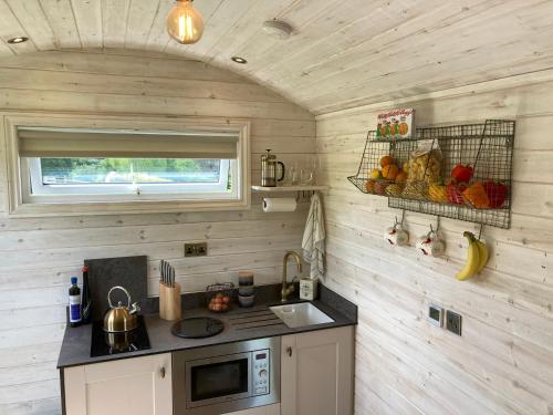 A kitchen or kitchenette at Slades farm Glamping