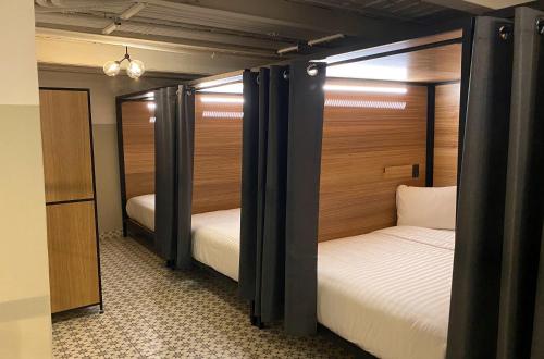 Una cama o camas en una habitación de Hostal CASA MX centro