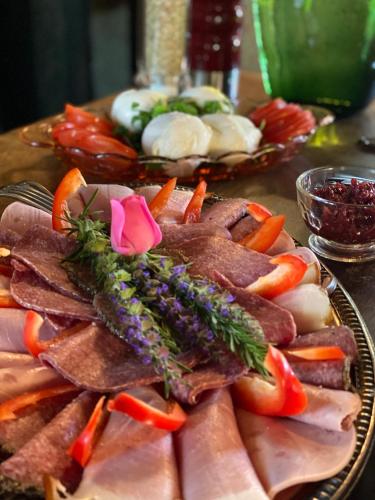a plate of meat and vegetables on a table at Altes Handelshaus Plauen in Plauen