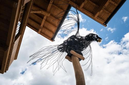 a sculpture of a bird hanging from a roof at KaiserMoments in Going