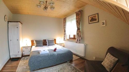 a bedroom with a bed and a window at Uroczysko starych sztolni in Szklarska Poręba