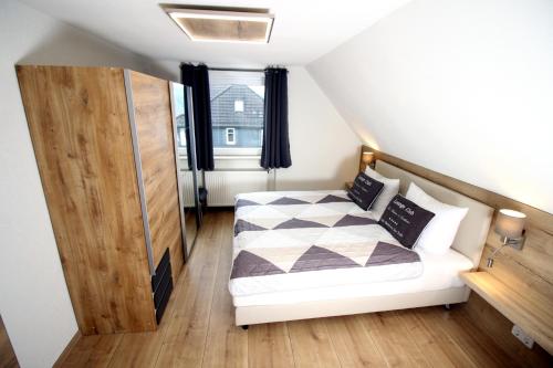 Una cama o camas en una habitación de Germina Apart