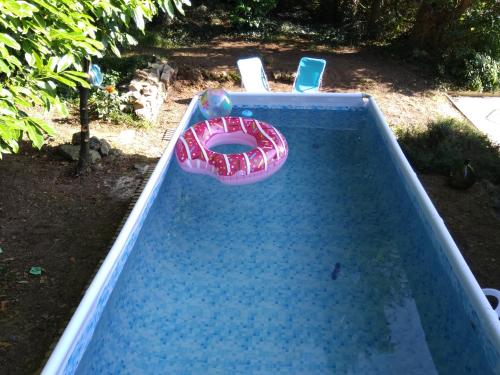 a swimming pool with at Les Gîtes du Château de Passillé in Parigné