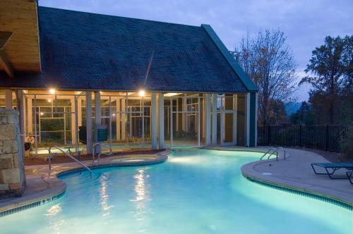 a swimming pool in front of a house at Brasstown Valley Resort & Spa in Young Harris