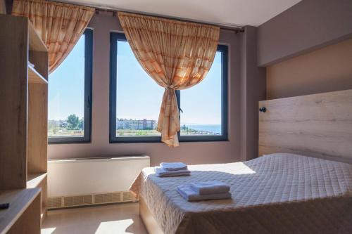 Ένα ή περισσότερα κρεβάτια σε δωμάτιο στο Via Mare Apartments