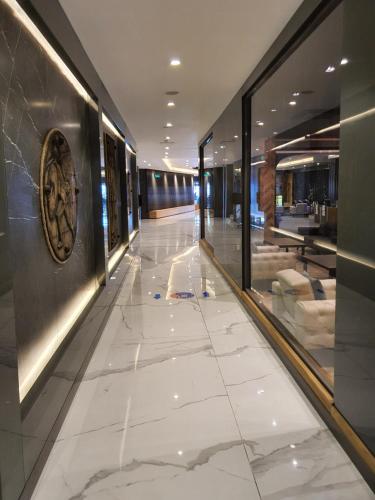 a hallway of a building with a tile floor at Akol Hotel in Canakkale