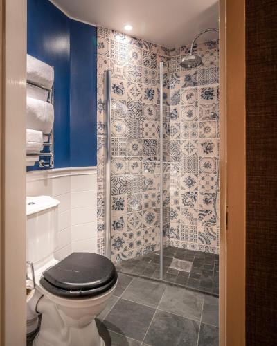a bathroom with a toilet and a shower at Victory Hotel in Stockholm