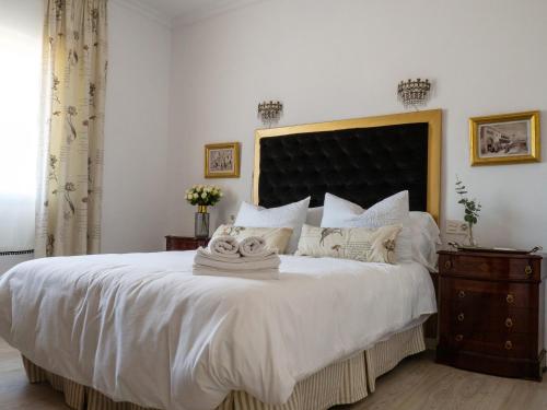 A bed or beds in a room at Casa Villamena