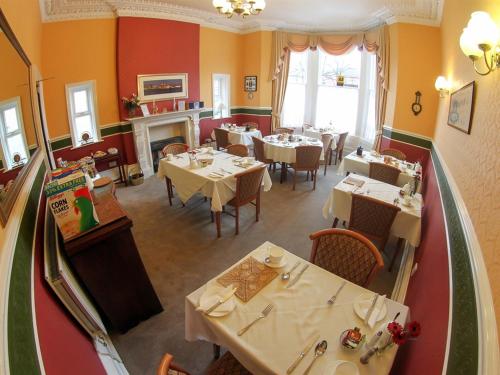 an overhead view of a restaurant with tables and chairs at The Bowden Lodge in Southport