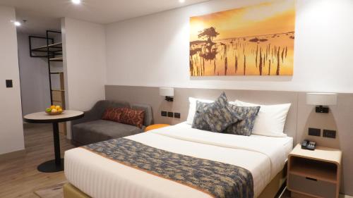 En eller flere senge i et værelse på Citadines Amigo Iloilo