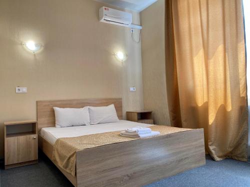 Ένα ή περισσότερα κρεβάτια σε δωμάτιο στο Guest House SOTNI