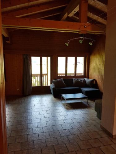 a living room with a couch and a table at Apartment in Brienz in Brienz