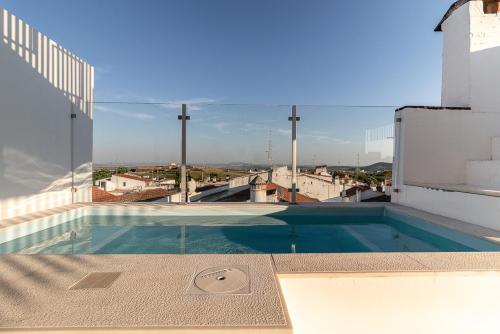 a swimming pool on the roof of a building at CASA d’OLIVENÇA in Elvas
