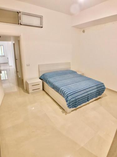 Una cama o camas en una habitación de Terrazza sul mare Pisciotta - Palinuro