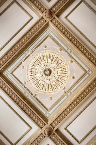 a ceiling of a building with a chandelier at Elite Plaza Hotel in Gothenburg