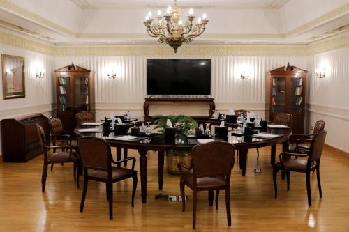 a conference room with a large table and chairs at Steigenberger Cecil Hotel Alexandria in Alexandria