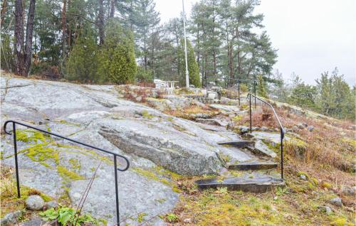 a set of stairs on a hill with trees at 3 Bedroom Lovely Home In Strömstad in Krokens Gård
