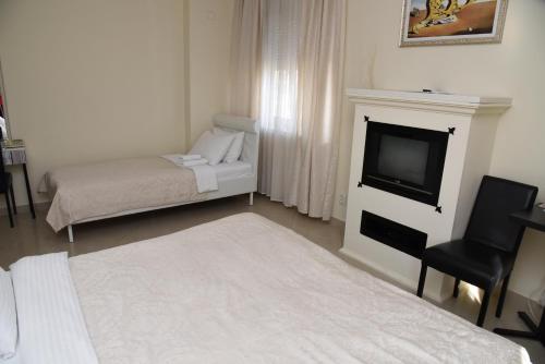 Postel nebo postele na pokoji v ubytování Garni Hotel Dash