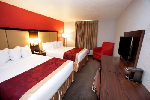 Postel nebo postele na pokoji v ubytování Ramada by Wyndham Keystone Near Mt Rushmore