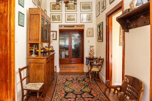 a room with a hallway with a door and a rug at Green Olive Guesthouse in Robertson