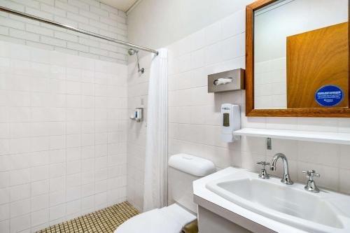 a bathroom with a sink, toilet and mirror at Comfort Inn Benalla in Benalla